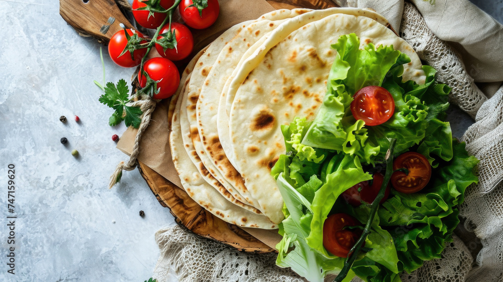 Fresh and colorful plate of tortillas with lettuce and tomatoes, perfect for food blogs or restaurant menus - obrazy, fototapety, plakaty 