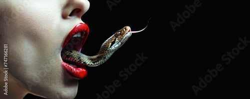 Snake coming out of the mouth of a woman. Hate speech, verbal abuse and blasphemy concept. photo