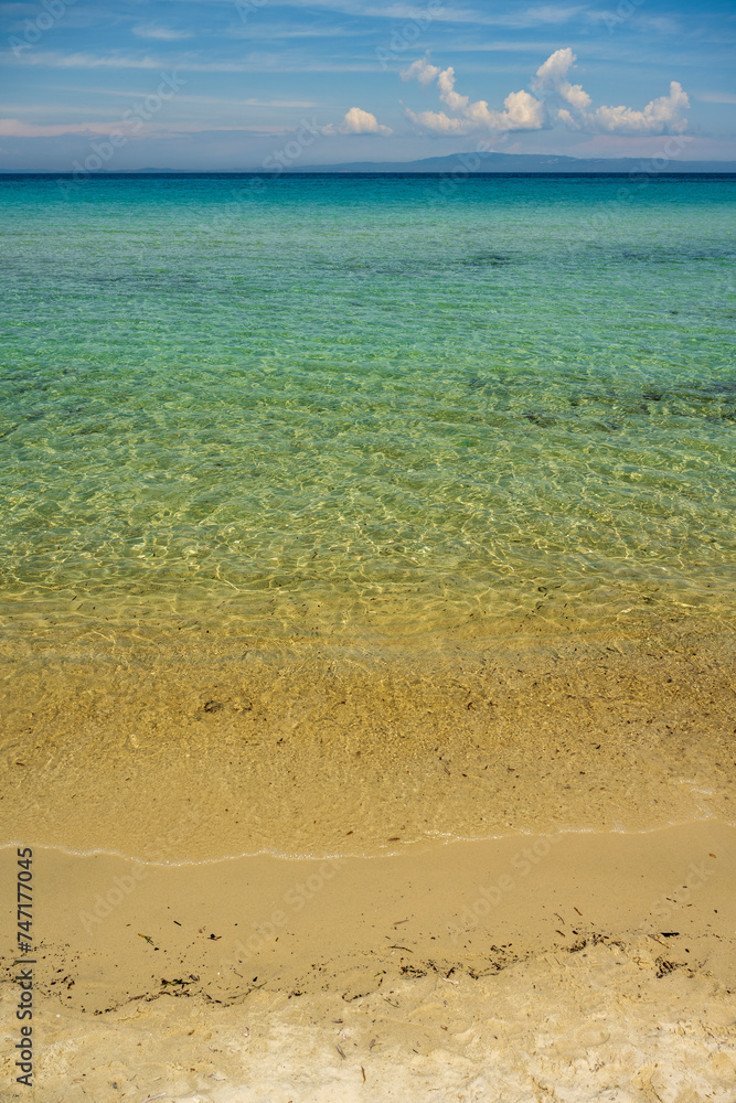 Panoramic view of Karidi beach. Vourvourou, Sithonia, Greece, Halkidiki. Wild beautiful beach with turquoise water. Mediterranean panorama landscape of Karidi sandy beach.	