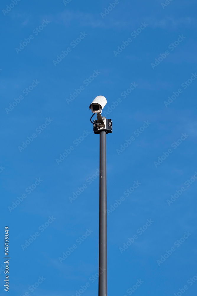 Security camera on the public road. Video surveillance.Surveillance with security cameras on the street for the safety of citizens. Security camera on the public road. Video surveillance.Surveillance with security cameras on the street for the safety of citizens.