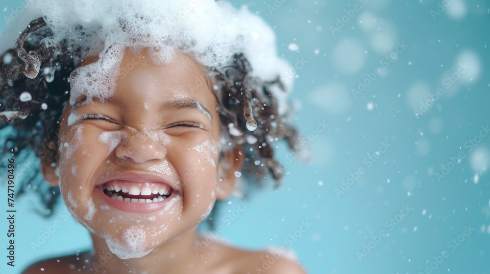 Happy child with soapy hair and face smiling broadly in a bath. Happy child with soapy hair and face smiling broadly in a bath.