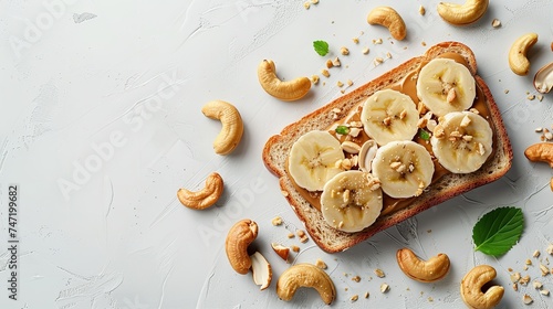 On a white table, toast with cashews, banana slices, and nut butter with top view and space for text, Generative AI. photo