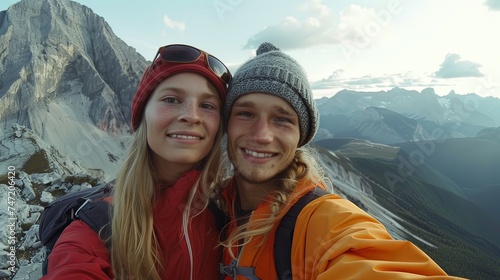 Cute happy young couple taking selfie on mountain © Barosanu