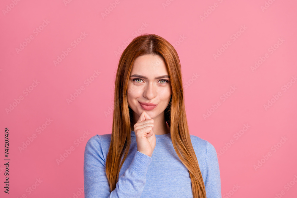 Portrait of smart confident girl with red foxy hairdo wear blue pullover think ideas hold finger on chin isolated on pink color background Portrait of smart confident girl with red foxy hairdo wear blue pullover think ideas hold finger on chin isolated on pink color background