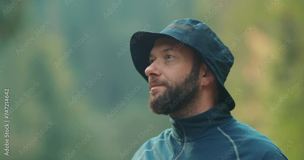 Male traveler, portrait close-up. Travel, hiking and camping concept happy man with cup camping in the forest. Male traveler, portrait close-up. Travel, hiking and camping concept happy man with cup camping in the forest.