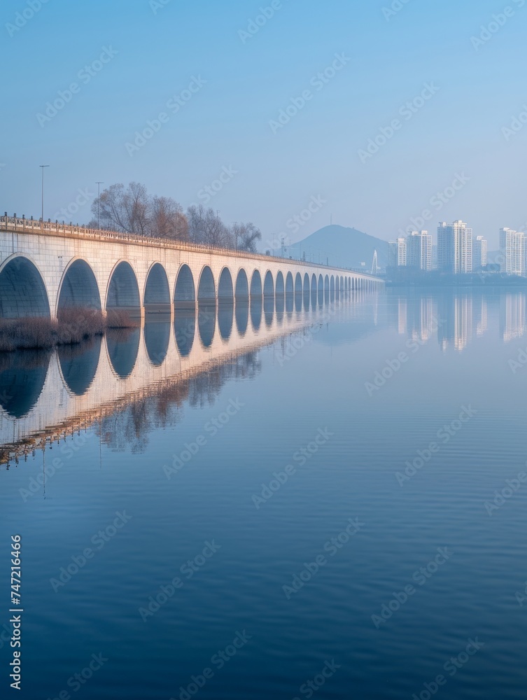 Fototapeta premium Stunning Bridge Over Large Body of Water
