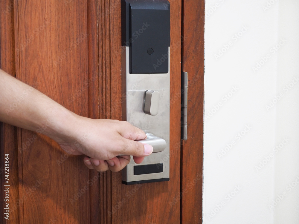 Traveler opening hotel room door by keycard. Traveler opening hotel room door by keycard.