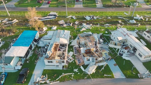 Badly damaged mobile homes after hurricane Ian in Florida residential area. Consequences of natural disaster photo