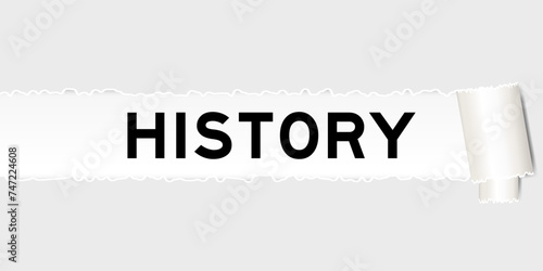 Ripped gray paper background that have word history under torn part
