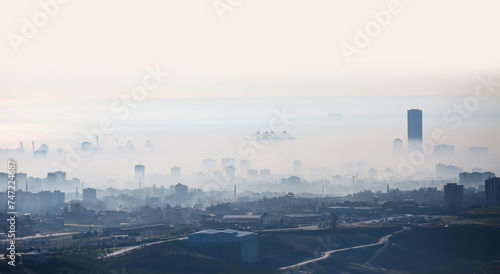 Cityscape of Mersin Downtown skyline on a foggy winter day - Aerial view of buildings and mersin port at a big city of Mersin, Turkey