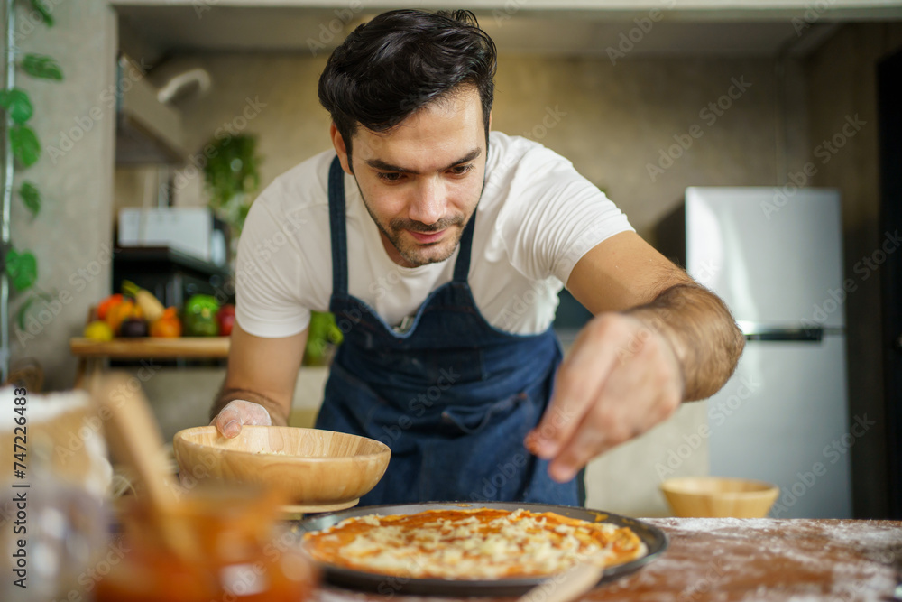 Man making a pizza.