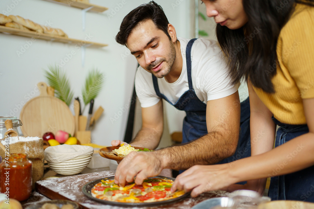 Man and woman making a pizza. Man and woman making a pizza.