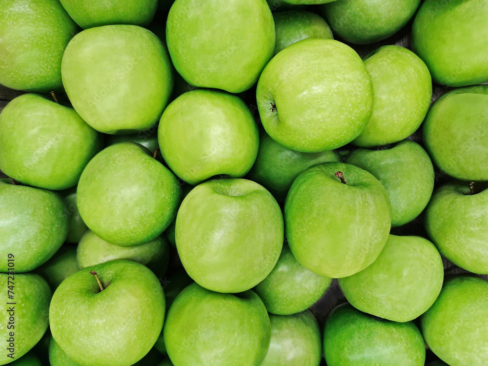 Green apples background. Top view or flat lay. Healthy natural food concept Green apples background. Top view or flat lay. Healthy natural food concept