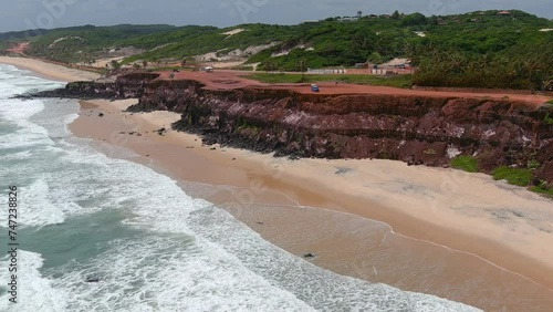 Pipa's beach became known as Itacoatiara, which means 'writing or drawing on stone' due to its colorful cliffs. (Praia da Pipa, Brazil). photo