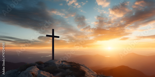 Silhouette of a christian cross on a hill in a mountain landscape at sunset,Sunrise Behind the Cross on Mountain Summit 