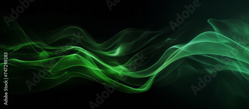 Creative abstract composition of green smoke on black background, banner