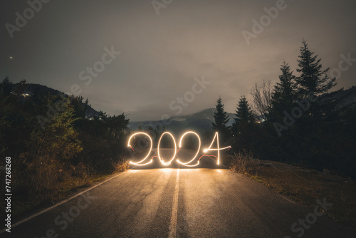 Year 2024 lightpaint on a mountain road 