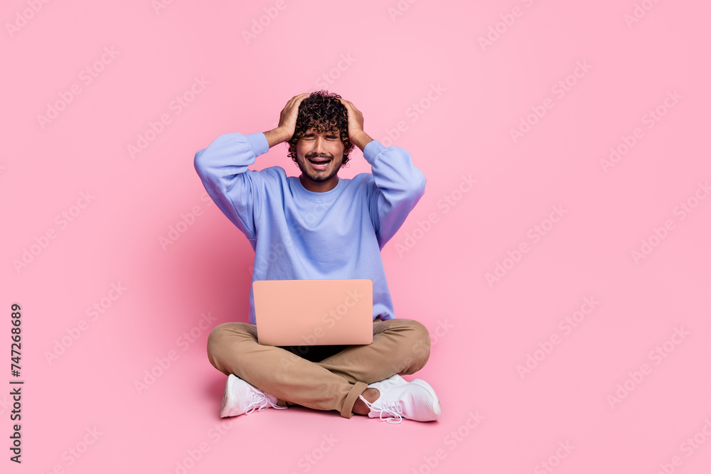 Photo of sad disappointed man crying lost money esports betting gambling isolated on pink color background Photo of sad disappointed man crying lost money esports betting gambling isolated on pink color background