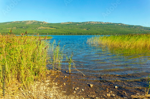 Alpine lake talkas against the backdrop of the Irendyk ridge of the Southern Urals in the Republic of Bashkortostan photo