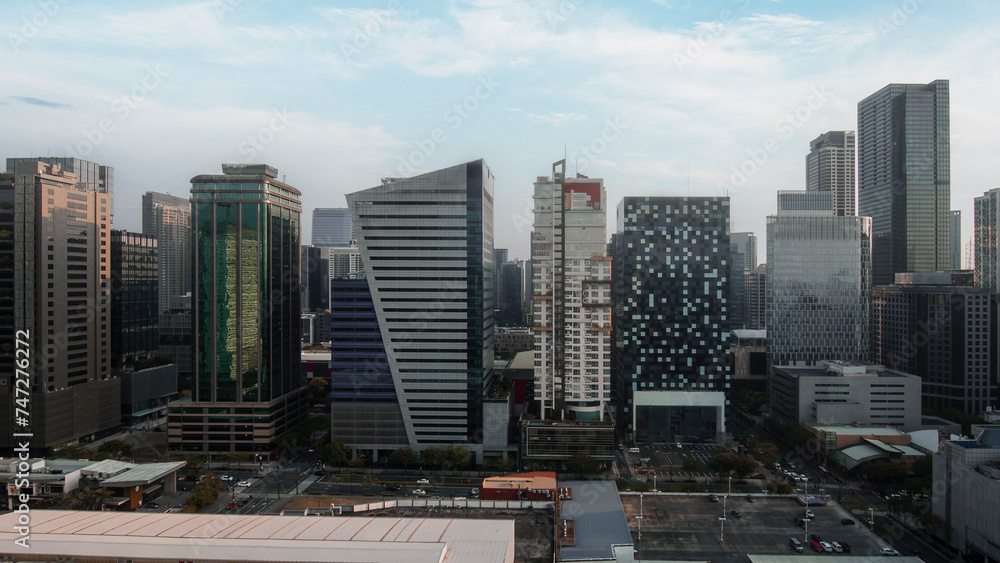 Urban landscape at dusk capturing the modern architecture of BGC, Metro Manila's bustling business hub.