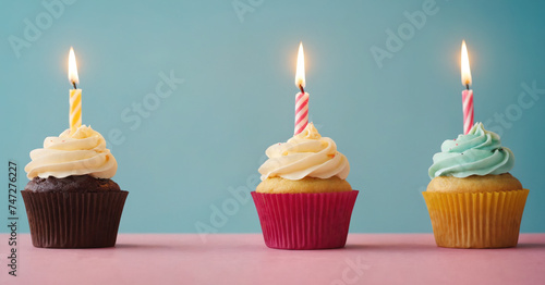 A golden 1st birthday cupcake adorned with a candle, perfect for celebrating the milestone.