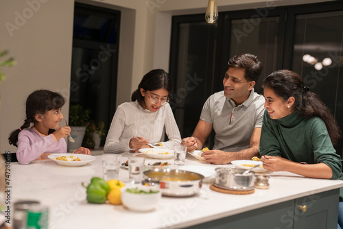 Photography Family dining at home in evening