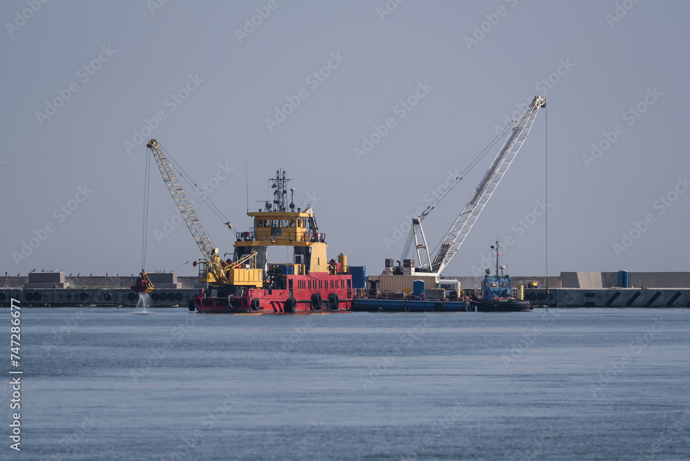 DREDGER - A specialized ship works in the sea port