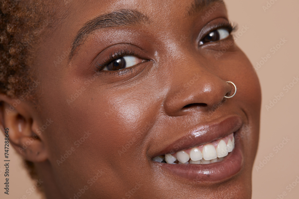 Close-up of smiling woman with nose ring Close-up of smiling woman with nose ring