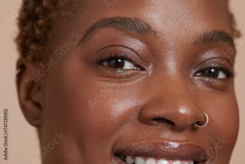 Close-up of smiling woman with nose ring