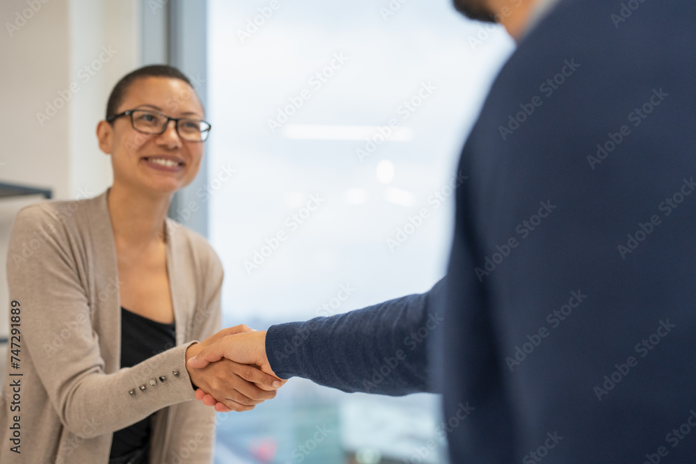 Business people greeting in office Business people greeting in office