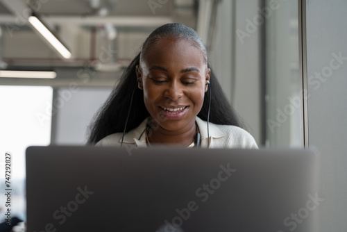 Businesswoman attending video conference in office