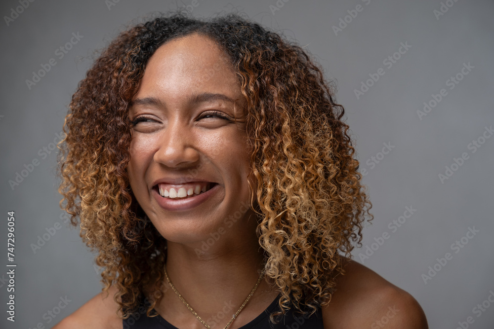 Portrait of smiling woman with curly hair Portrait of smiling woman with curly hair
