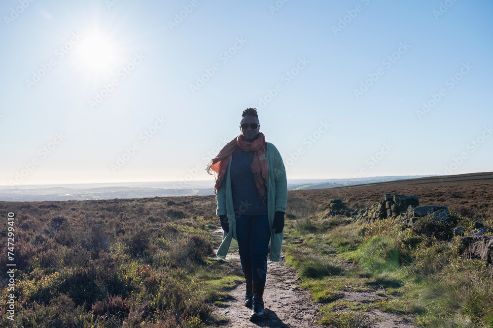 Senior woman hiking in moorland