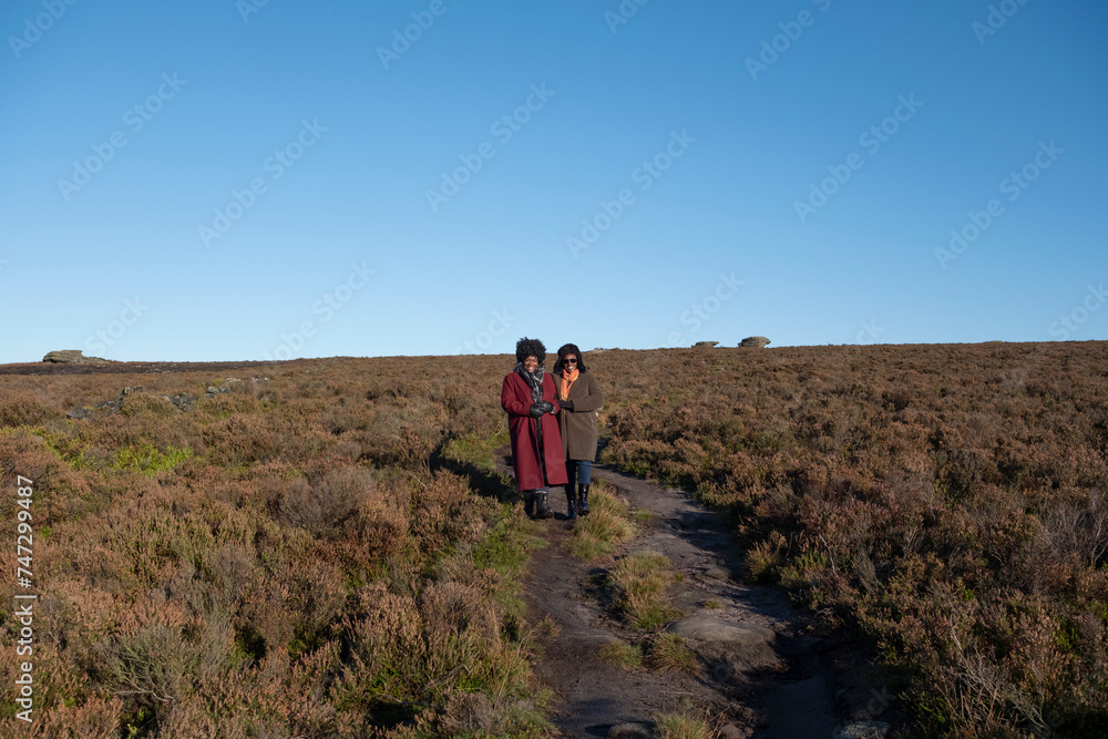 Two women hiking in moorland