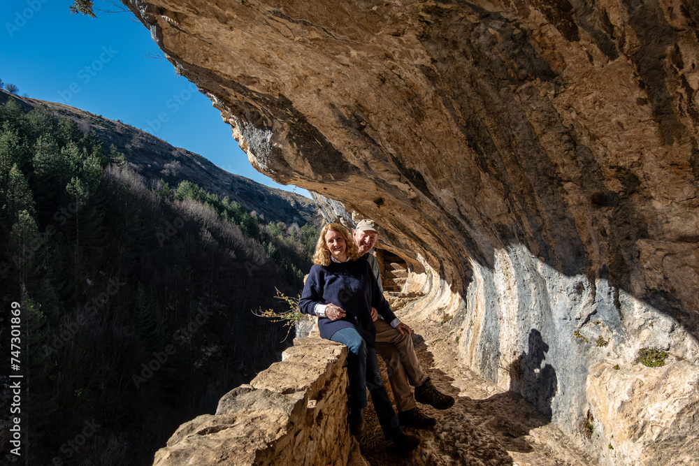 Roccamorice, Italy A tourist couple visit the ancient Eremo di san Bartolomeo monastery in the Majella mountains. Roccamorice, Italy A tourist couple visit the ancient Eremo di san Bartolomeo monastery in the Majella mountains.