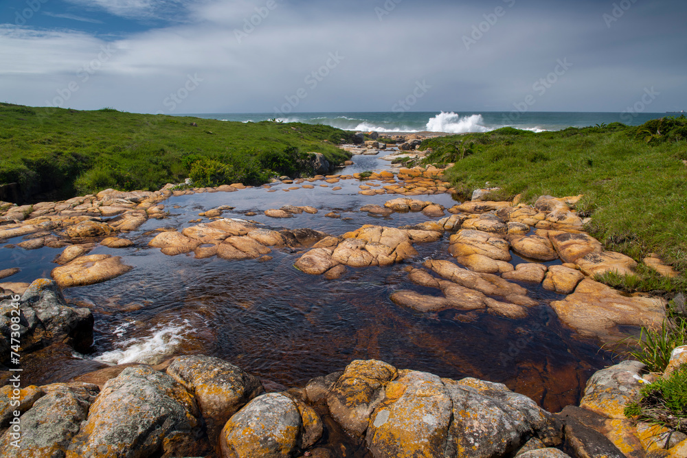 The Wild Coast, known also as the Transkei, is a 250 Kilometre long stretch of rugged and unspoiled Coastline that stretches North of East London along sweeping Bays, footprint-free Beaches, lazy Lago
