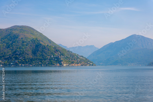 Alpine Lake Lugano with Mountain in a Sunny Day in Morcote, Ticino, Switzerland. © Mats Silvan