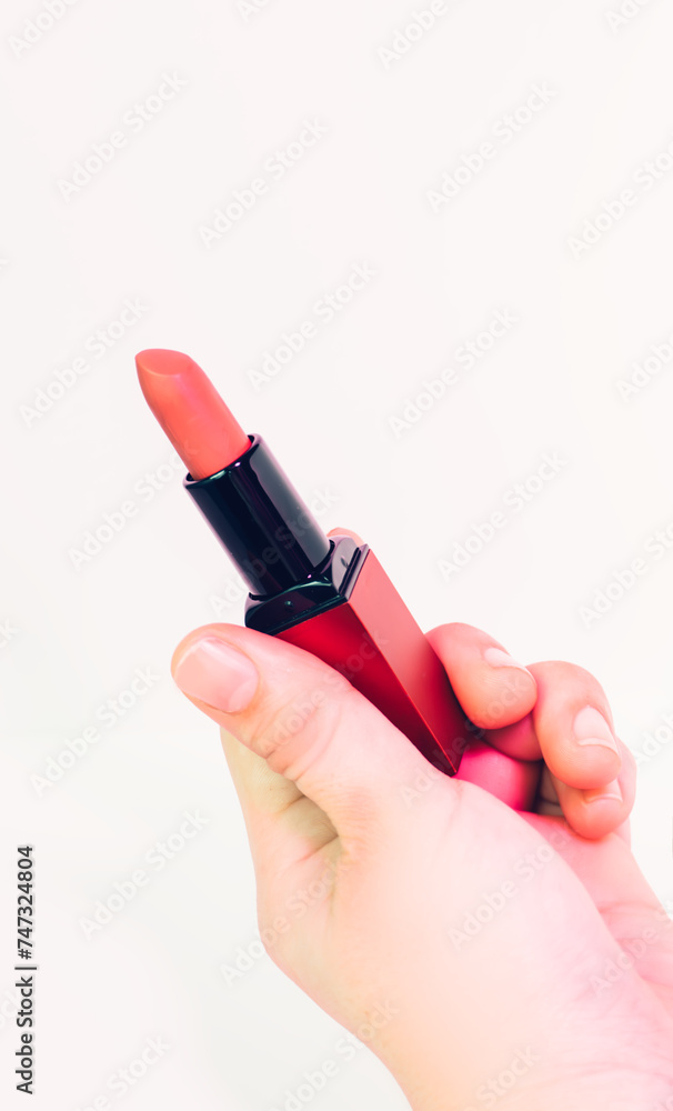 Holding the lipstick. It can used on poster, banner and social media postings. Holding the lipstick. It can used on poster, banner and social media postings.