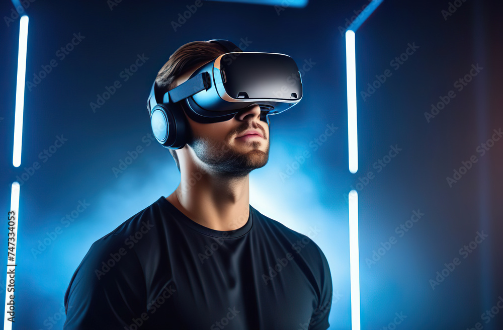 Young man using virtual reality headset. VR, future, gadgets, technology concept Young man using virtual reality headset. VR, future, gadgets, technology concept