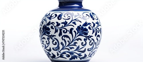 A cobalt blue porcelain ceramic vase with traditional folk painting and patterns, placed on a white surface.