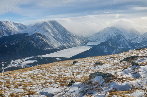 Snow-covered winter mountain lake, Russia, Siberia, Altai mountains.