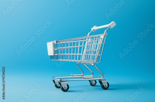 empty shopping cart on blue background