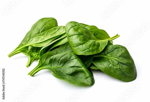 Pile of fresh green baby spinach leaves isolated  on white background. Close up