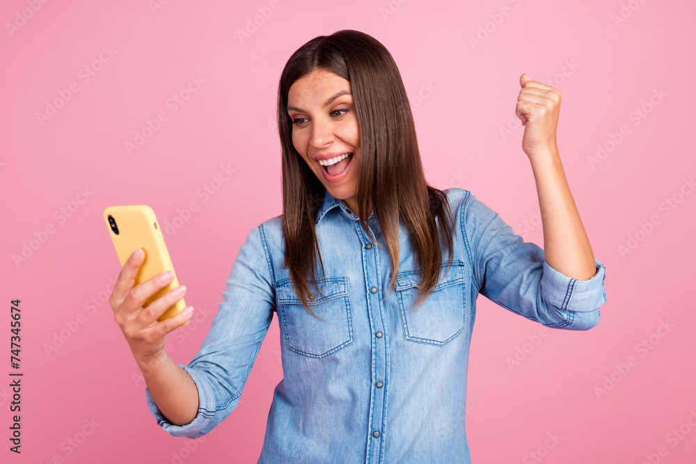 Young brunette woman over isolated pastel background sending a message with the mobile Young brunette woman over isolated pastel background sending a message with the mobile