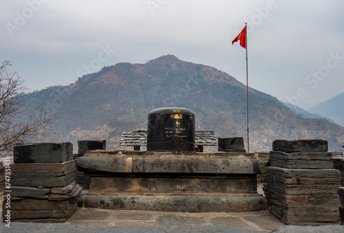 Big Shiva Linga Sculpture: Lakhamandal Temple, Himalayan Mountains Background photo