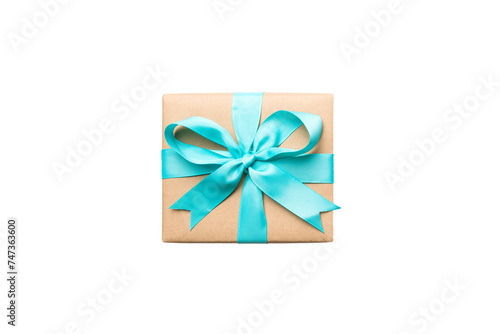 Holiday present box on a Isolated. Gift box with colored bow on white background top view close up © sosiukin