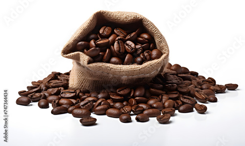 pile of coffee beans spilling from bag on white background
