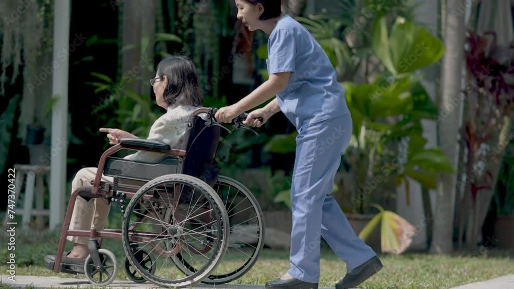 Elderly woman relaxing on wheelchair in backyard with caregiver. Elderly woman relaxing on wheelchair in backyard with caregiver.