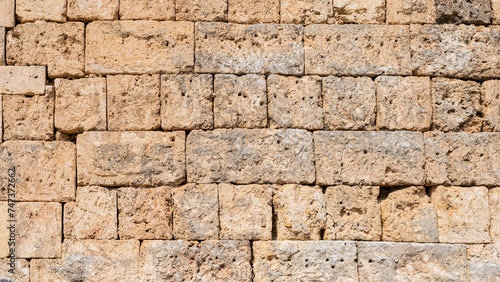 close-up of the stone wall of the ancient Greek temple in the city of Perga in Turkey