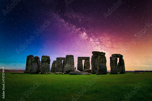 Landscape image of Milky way galaxy at night sky with stars over Stonehenge an ancient prehistoric stone monument, Wiltshire, UK.